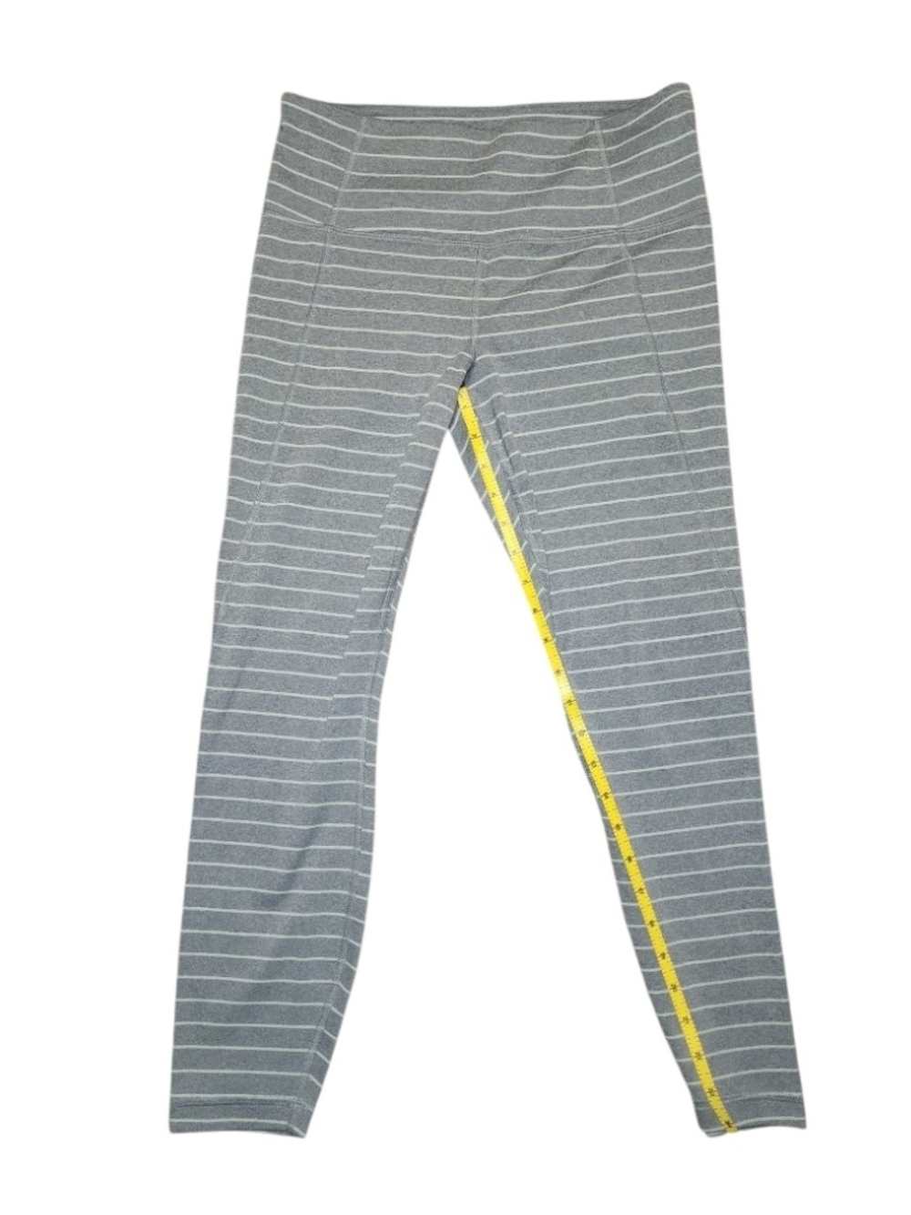 Athleta Salutation Stripe 7/8 leggings in a light gray heather color.